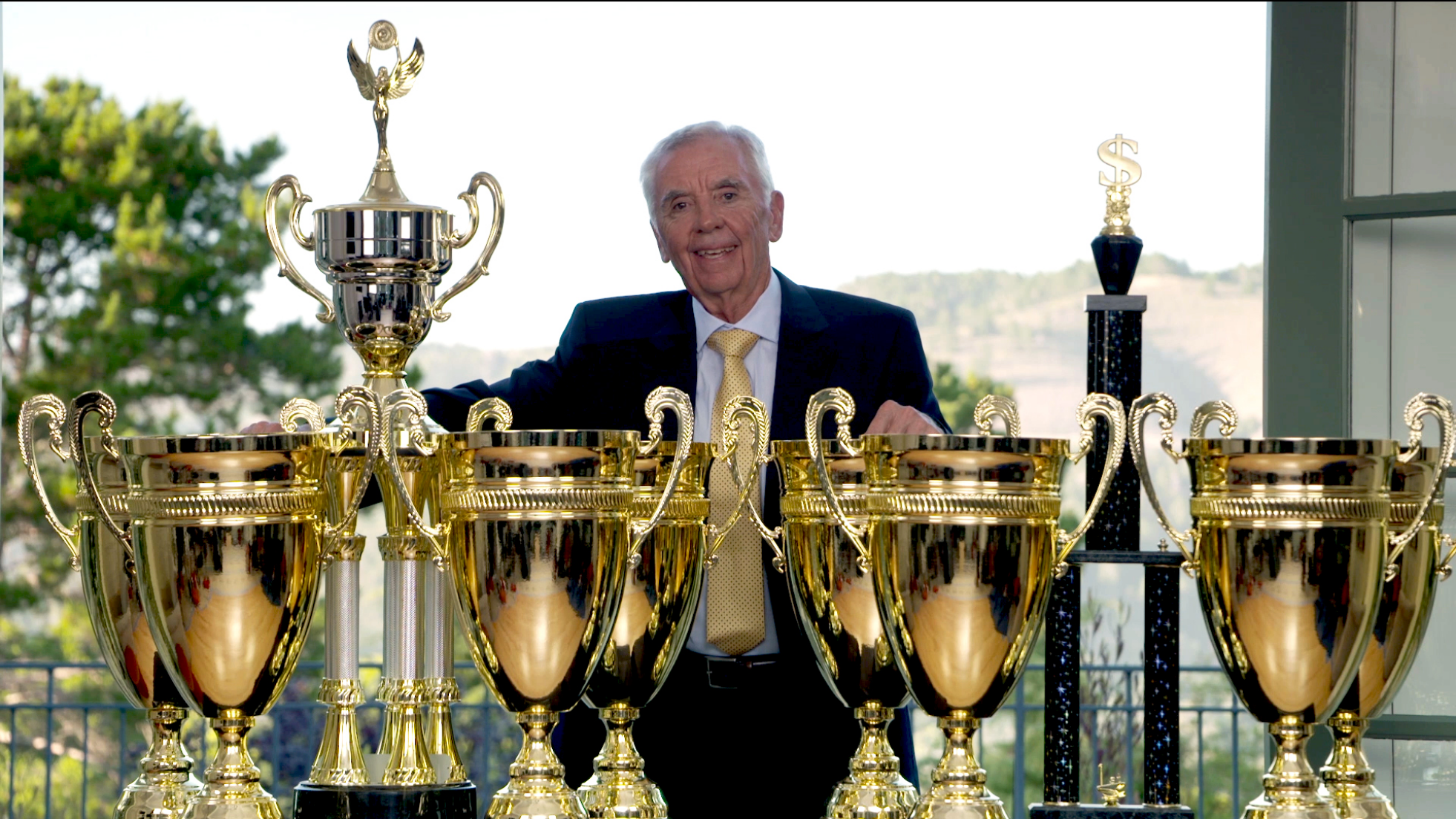 Chuck Hughes with trophies